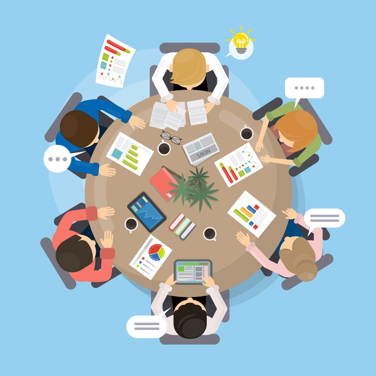 people sitting around a table planning